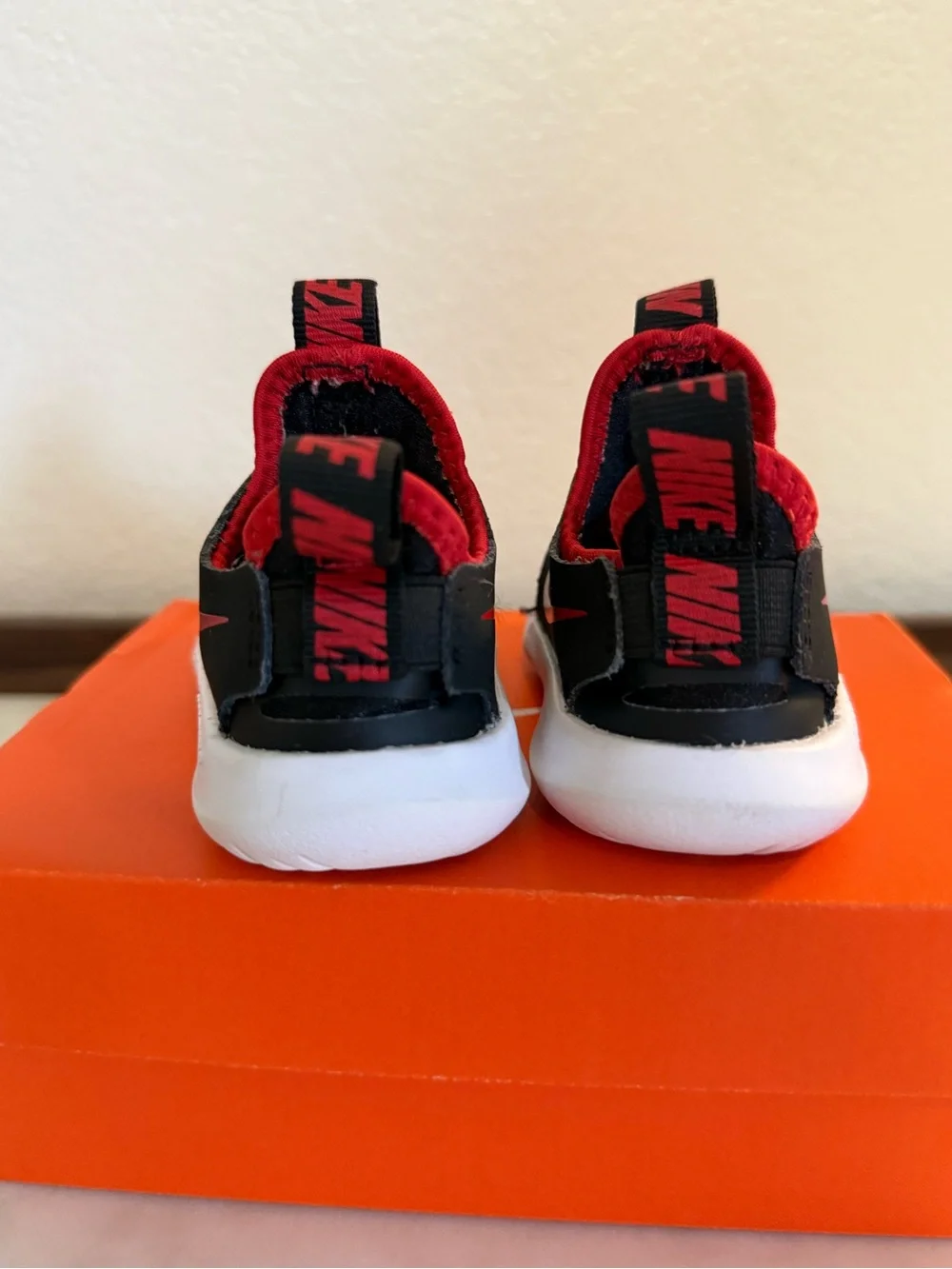 Nike Kids Black and Red Slip-On Sneakers with White Sole